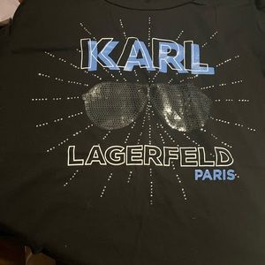 Is a T-shirt black Xl never used don’t have any bad details-